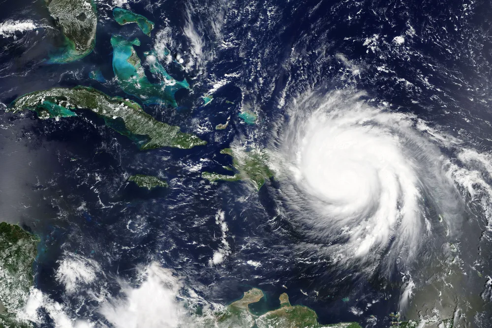 A satellite view of a large hurricane approaching a land area. 