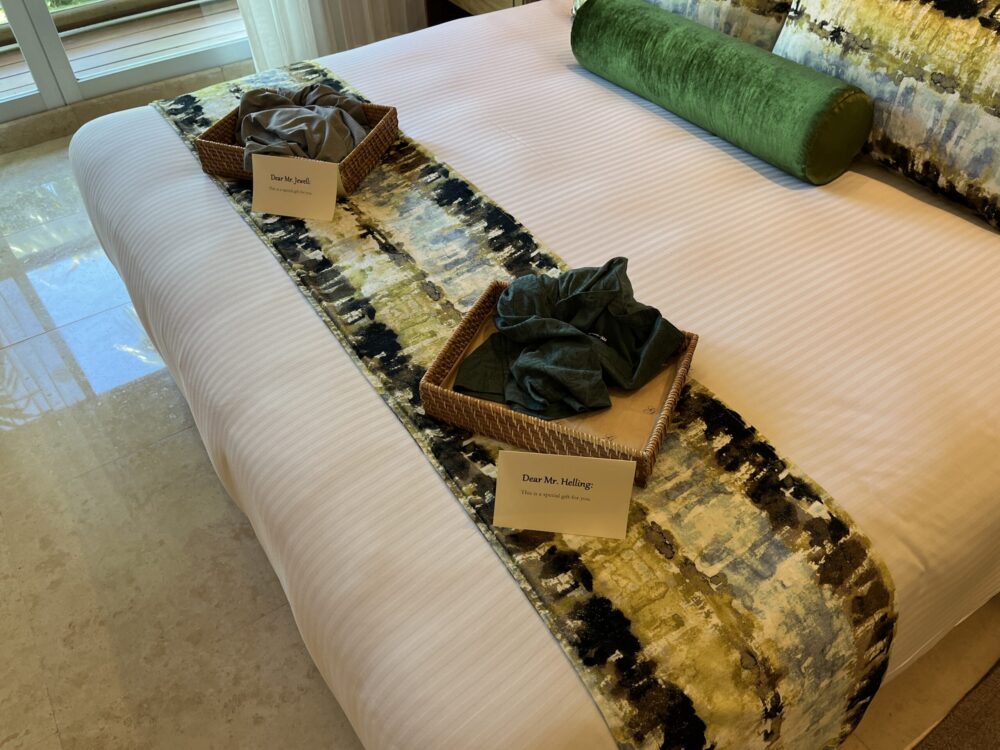 Shirts on the bed of the author's hotel room at the Vidanta Grand Luxxe