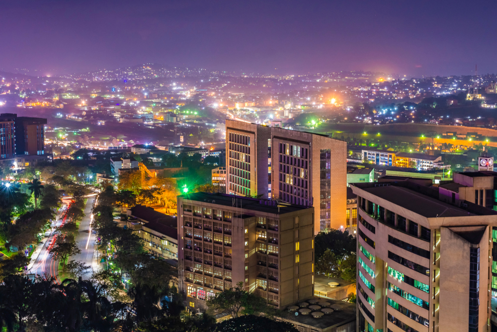 The city of Kampala during dusk where city lights look like thousand stars in the misty city air, a beautiful scenery on one of the best places to visit Uganda.