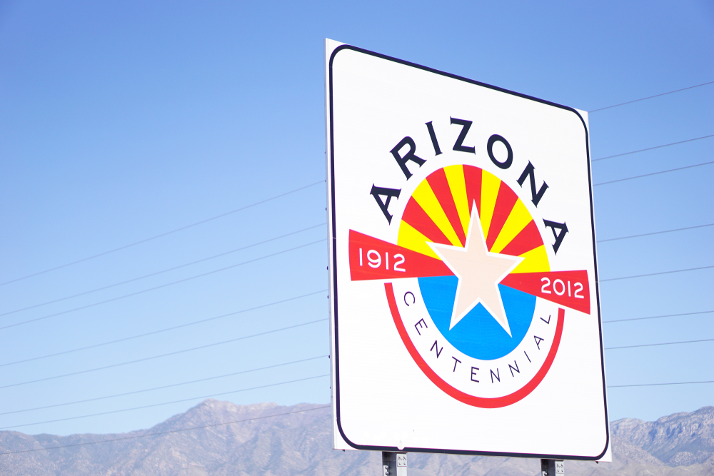 A road sign that says Arizona Centennial 1912 2012. 