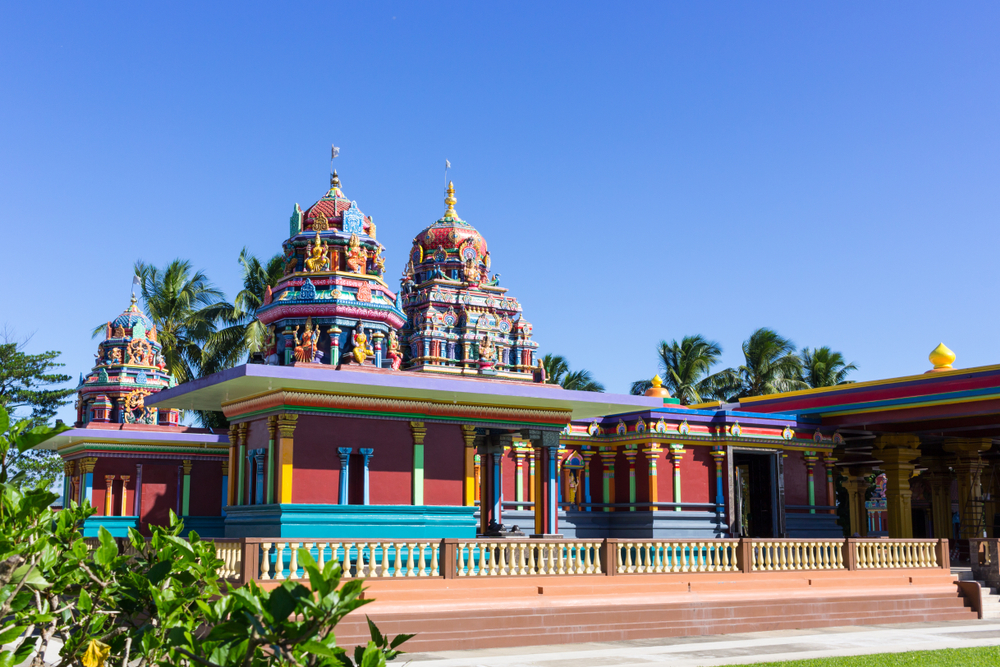 Sri Siva Subramaniya Temple in Nadi, Fiji stands colorfully on a nice day with blue skies for a guide on average flight times to Fiji