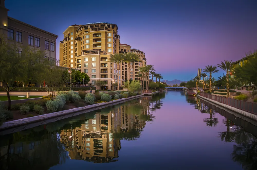Dusk photo of a canal running through the middle of Scottsdale pictured during the best time to visit Arizona