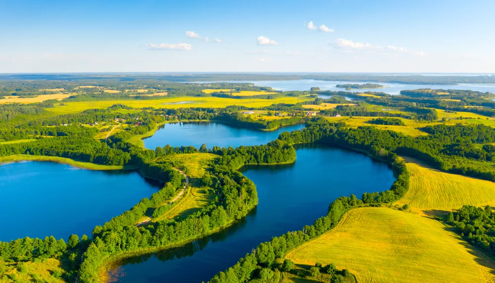 Aerial view of several lakes where their banks are surrounded by trees, a piece for the guide titled what is in Eastern Europe.