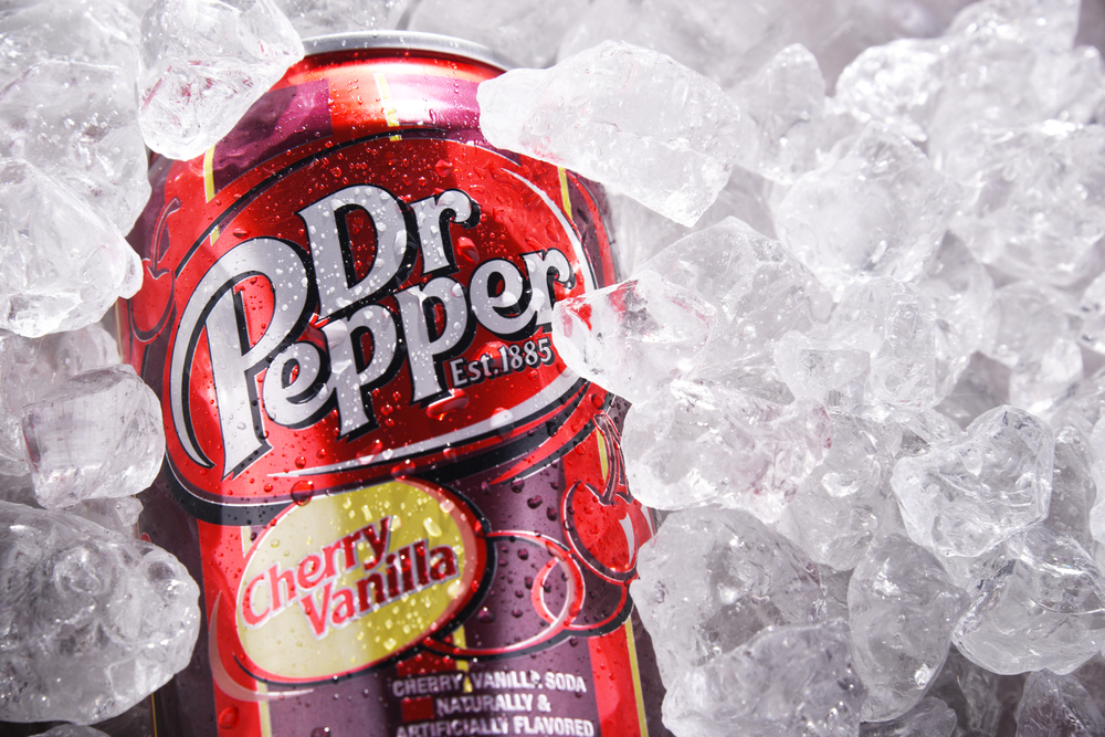 A Dr Pepper can drink placed on ice. 