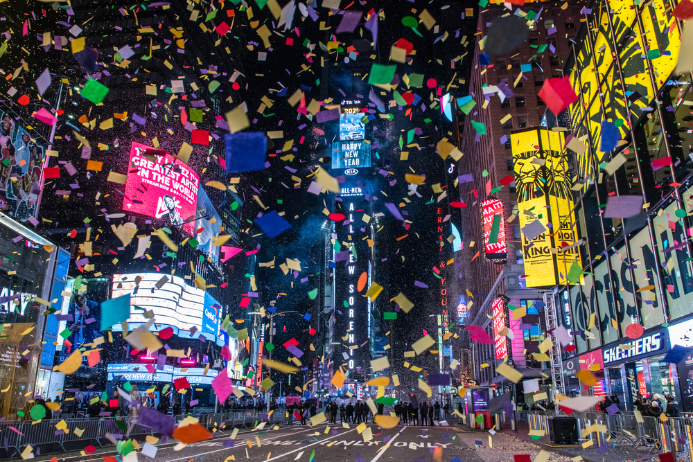 New York City's Times Square with confetti on New Year's Eve 2020 for a list of the best places to spend New Years in the USA