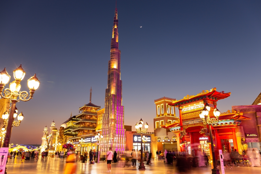 A city with miniature attractions from other countries decorated by lights, including the famous Burj Khalifa, an image for the guide on the best time to visit Dubai.