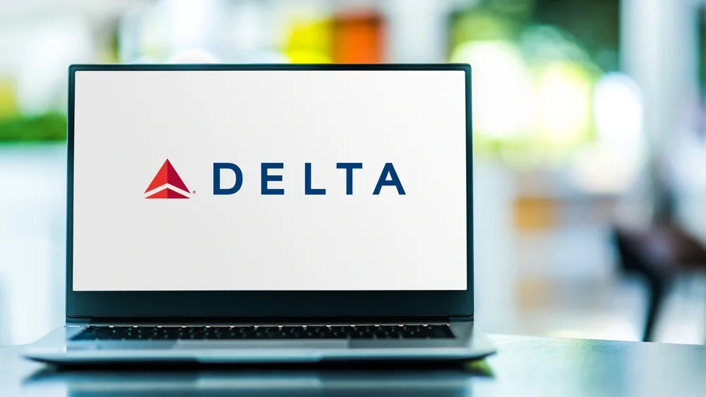 A laptop displaying the logo of Delta airlines. 