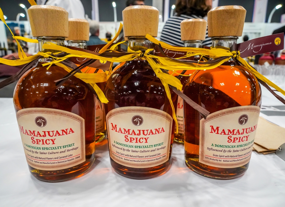 Bottles of a beverage that has a label Mamajuana.