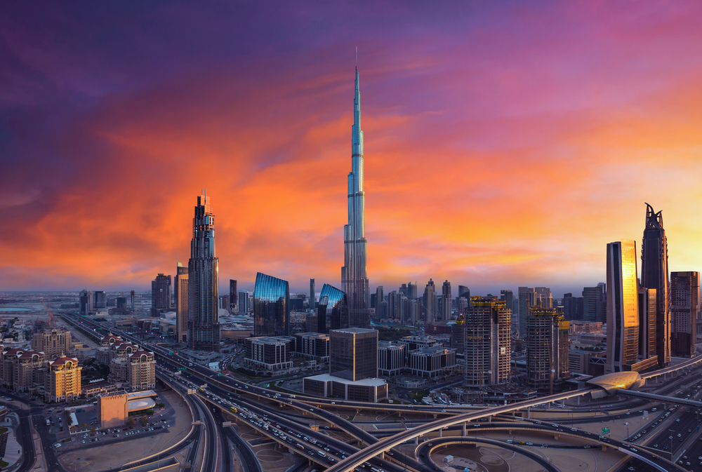 Sunset over the skyline of Dubai where the iconic Burj Khalifa can be seen, an image for the guide about the best time to visit Dubai.