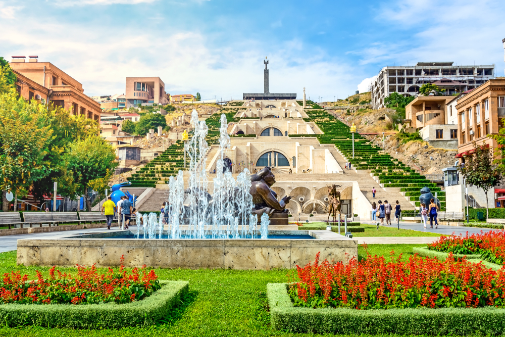 For a piece on whether or not Armenia is safe to visit, a fountain and giant stairway in front of the statue in Yerevan