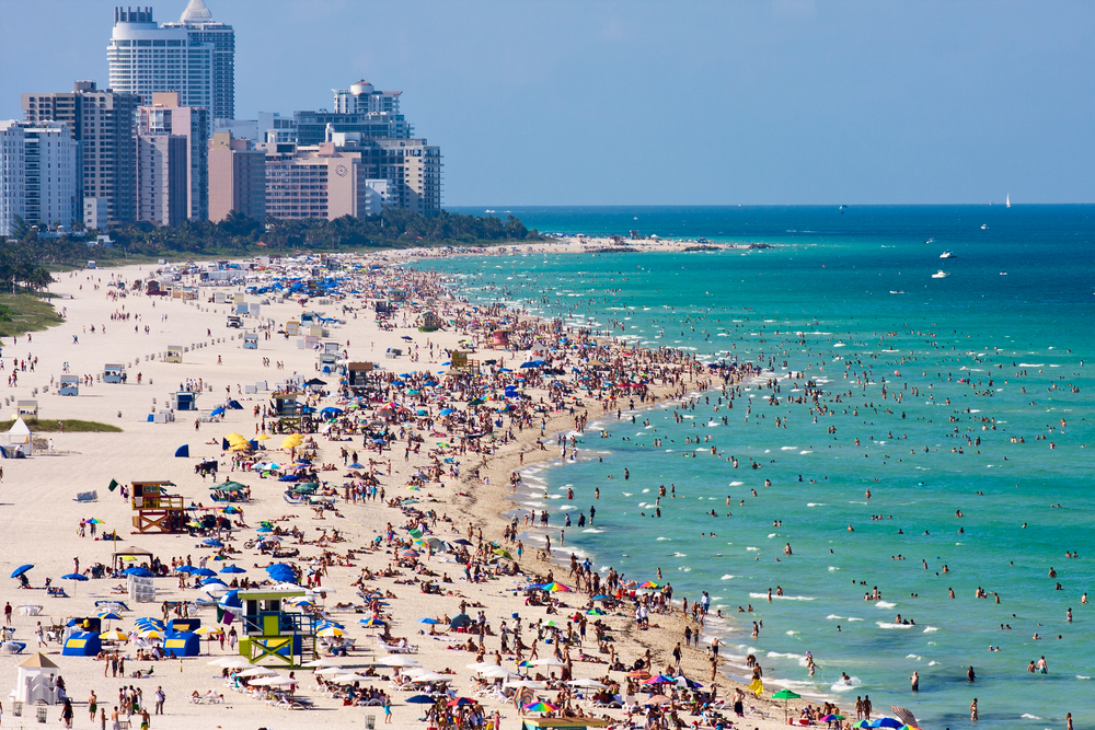 Crowded South Beach in Miami, as seen from the air from the port entry channel