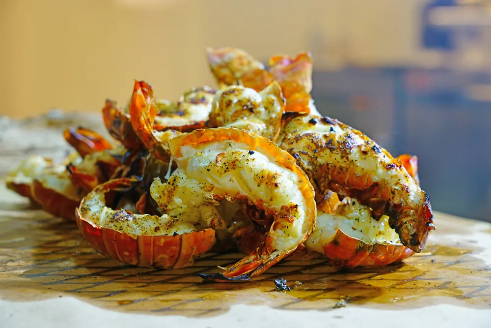 Sliced lobster prepared on a table, a piece on an informative guide about what is Caribbean food.