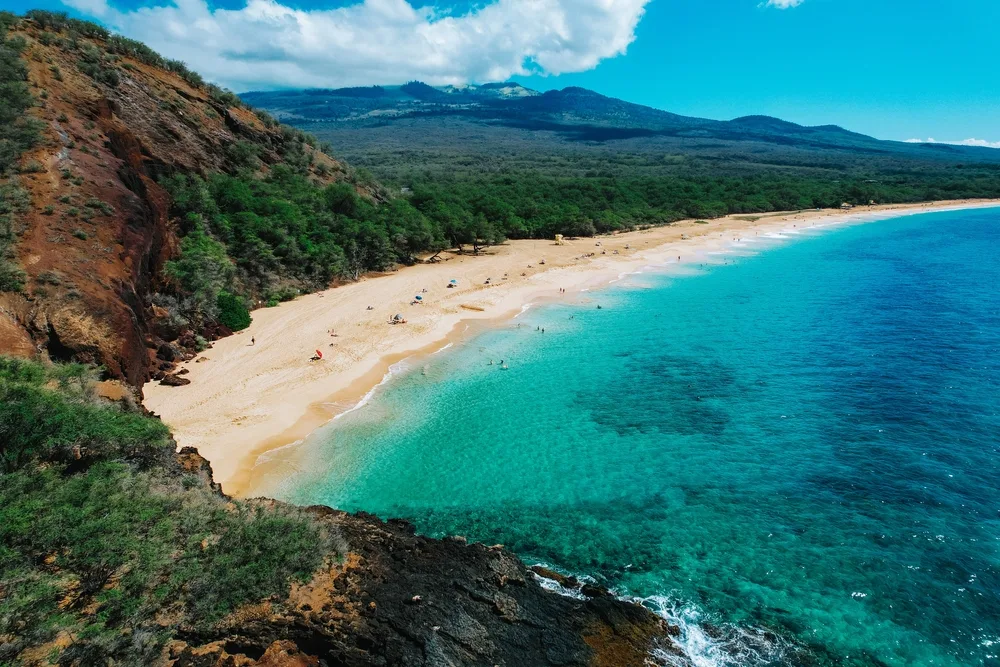 Aerial shot of Big Beach on Maui with a long stretch of white sand for a frequently asked questions section covering do you need a passport to go to Hawaii?