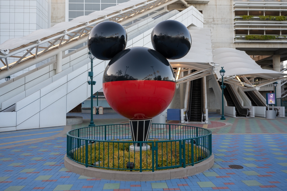 Photo of a mickey Mouse sculpture pictured outside of an escalator for a guide to when to visit Disneyland