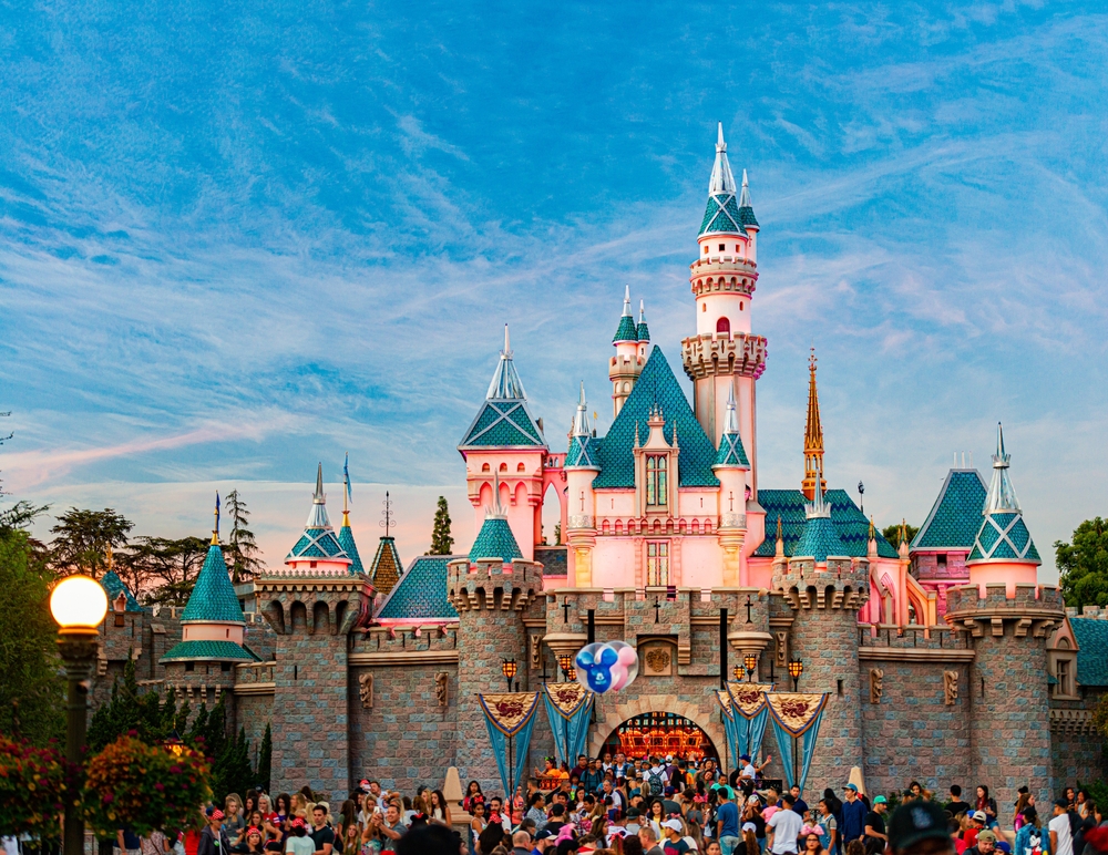 View of the castle in Disneyland, taken during the best time to visit, with blue sky overhead