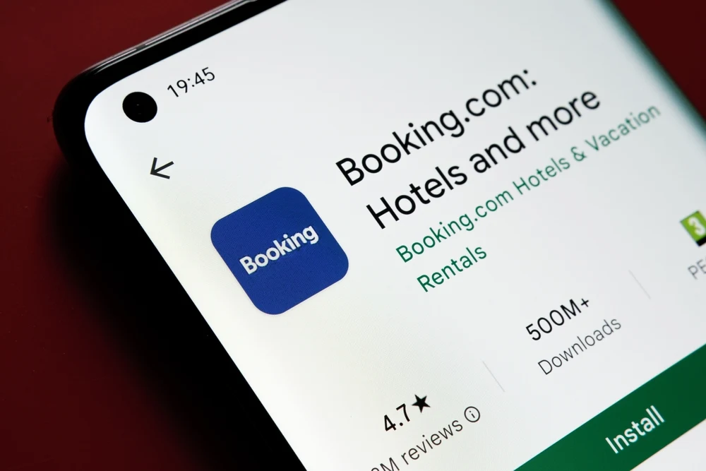 Close-up of Booking.com app download screen in the App Store showing review rating and details for a Booking.com vs Expedia comparison guide