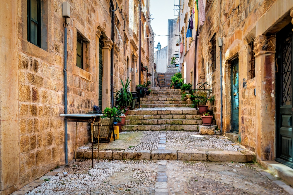 Photo of the old city street during the least busy time to visit Croatia with stones between the walls
