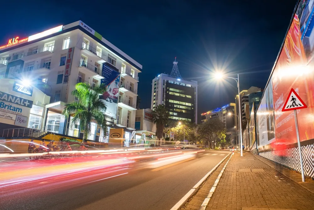 Center of Kigali in a low-shutter image at night with cars driving by