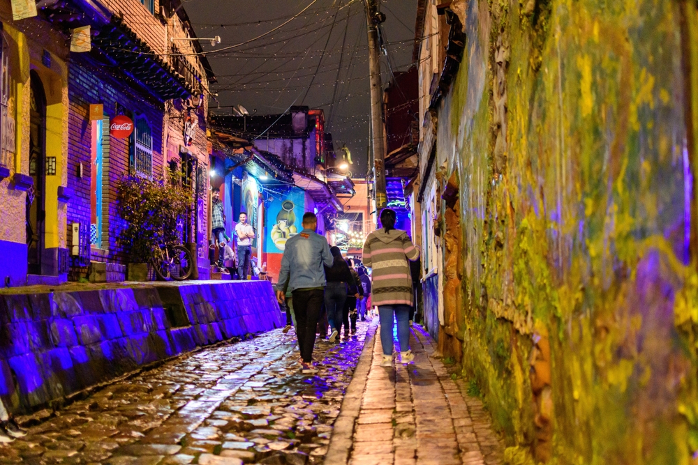 Photo of people walking along in the nightlife district of Bogota