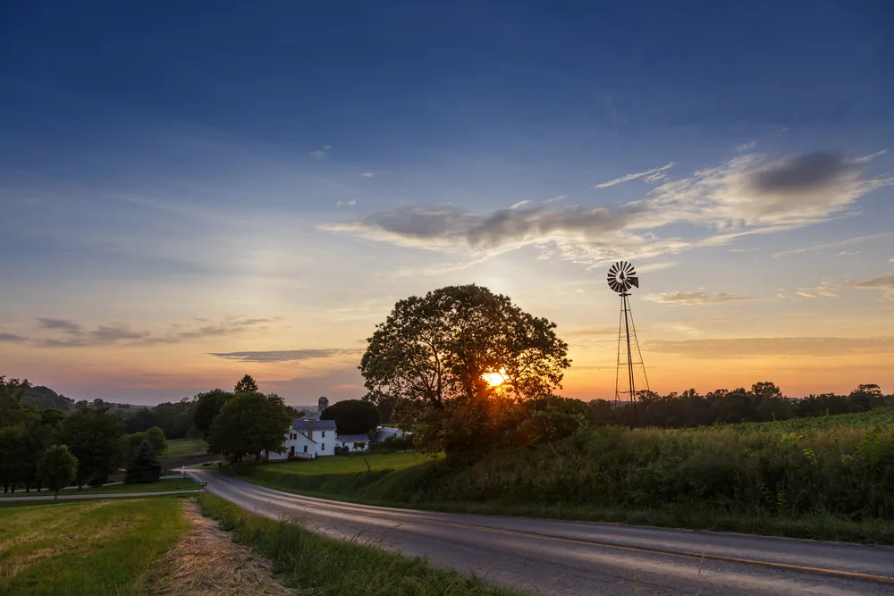 Windmill in a calm scene pictured on a clear evening during the least busy time to visit Amish Country