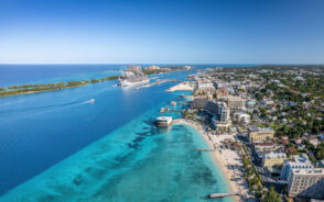 As a featured image for a guide titled Best Time to Visit Nassau, a photo from the air of a cruise ship in the harbor of Nassau