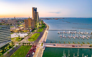 Aerial photo of Corpus Christi pictured with its stately downtown area towering over the bay for a piece titled Best Time to Visit Corpus Christi