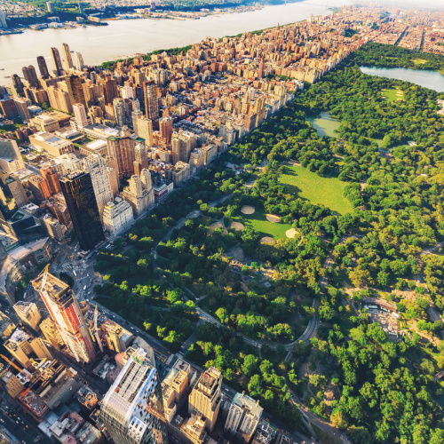 an aerial view of the Central Park where it is beautifully planned, the area is surrounded by tall skyscrapers where the area of the park remains preserved, photographs on one of the best time to visit New York.