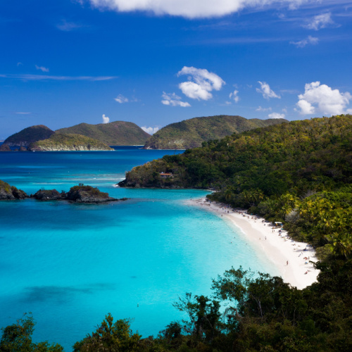 a beautiful paradise where islands are covered in greenery with white sand and blue waters during the best time to visit St. John.