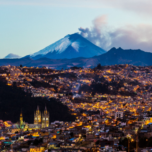 a town built near a volcano, where it can be seen smoking during dusk on one of the best time to visit Ecuador.