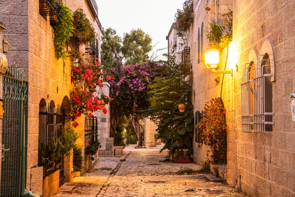 As seen at dusk during the least busy time to visit Israel, a photo of the empty stone streets in Mishkenot Shaananim