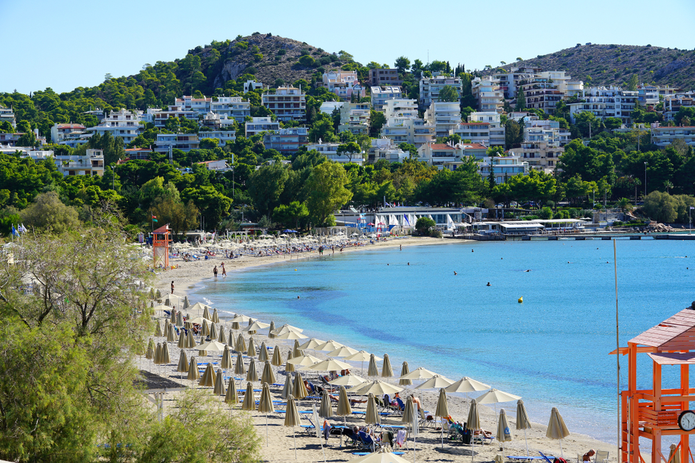 Gorgeous beach in Vouliagmeni, a town near Athens, pictured mid-summer during the best time to visit