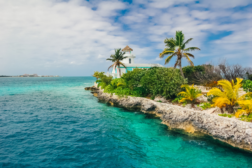 For a guide to the best and worst times to go to Nassau, a photo of the rocky coastline next to the deep blue water on Pearl Island
