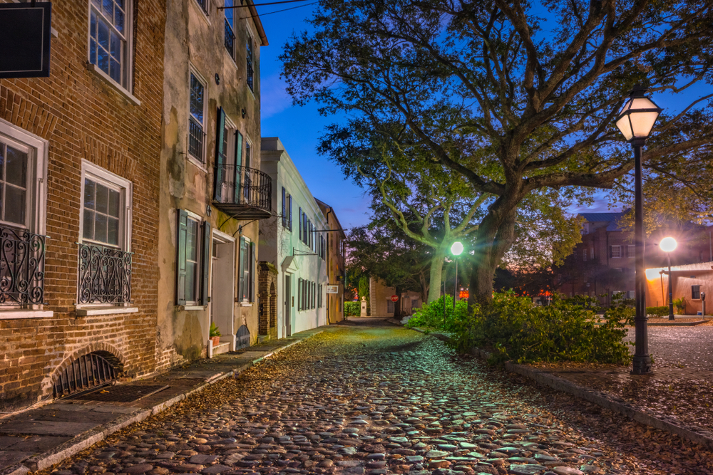 Quaint cobblestone road in Charleston pictured during the best overall time to visit the city