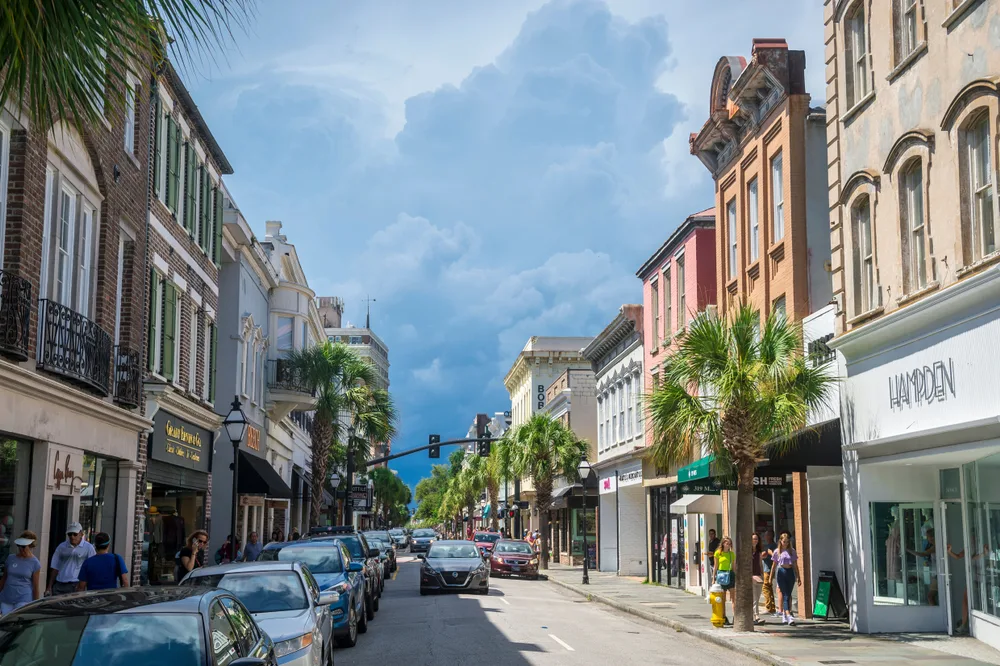 Photo of dark storm clouds on the horizon over historic King Street, pictured during the worst time to visit Charleston