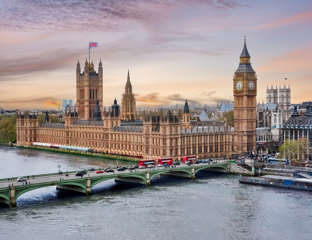 London's skyline and Tower Bridge with the Houses of Parliament and Big Ben visible at daybreak for an FAQ section concerning the best time to visit London overall