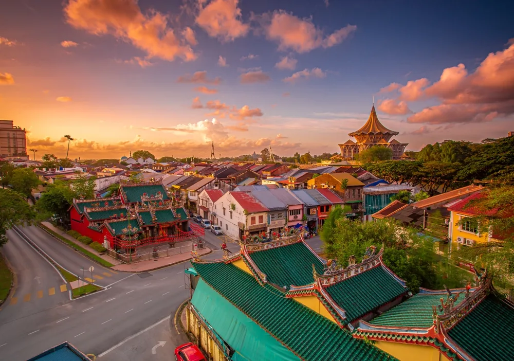 Aerial image of a gorgeous dusk sunset over Kuching with the Sarawak State building in the foreground in June, the overall best time to visit Malaysia