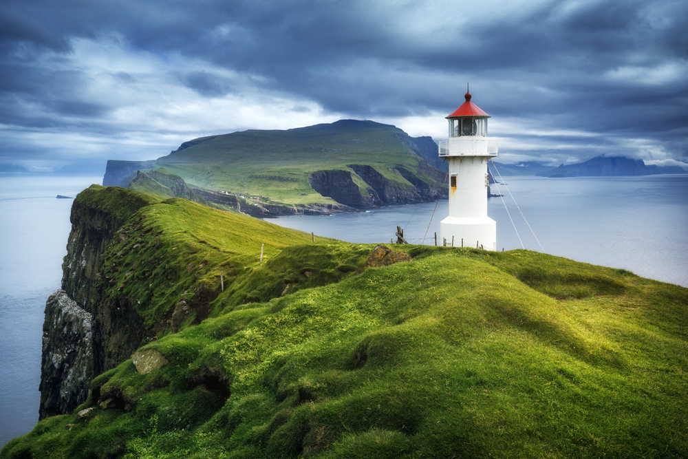 Aerial photo of the Mykines lighthouse on the Faroe Islands, pictured during the best overall time to visit