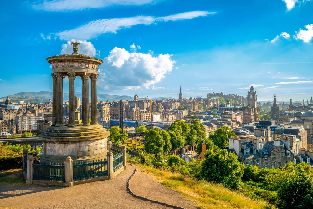 Gorgeous hilltop view of Calton Hill in Edinburgh, seen during the spring or summer, the best times to visit Scotland