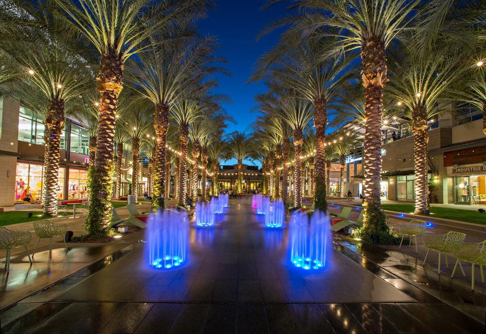 Cool view of trees and lighted fountains outside of a shopping mall in Scottsdale
