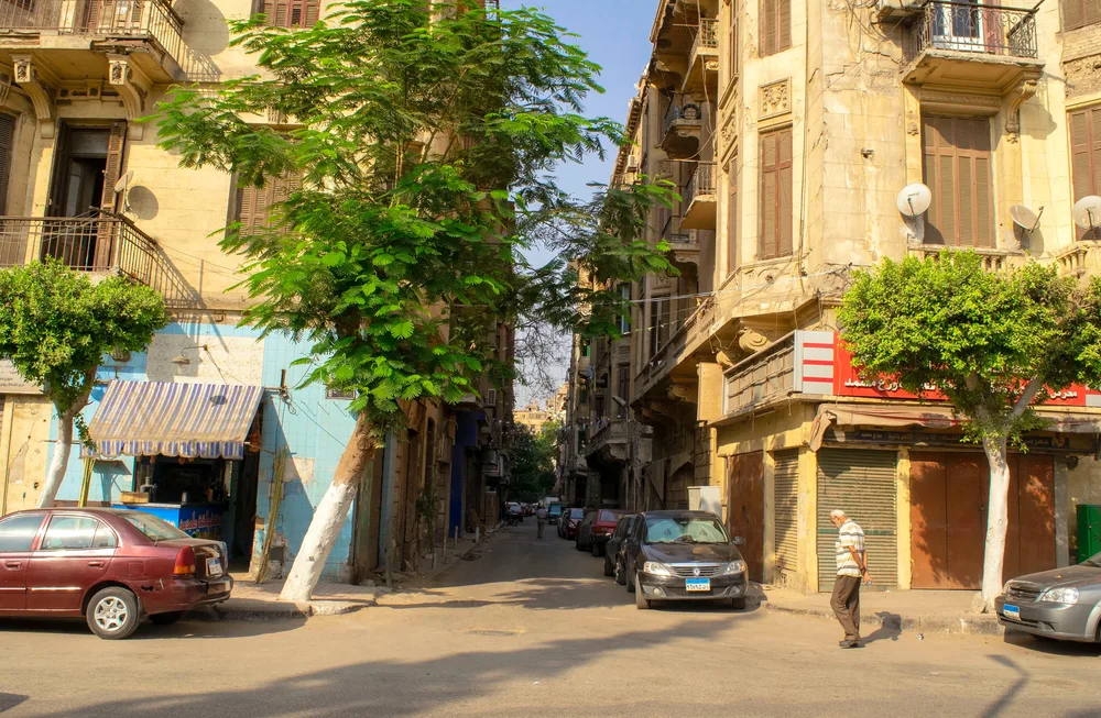Pictured during the overall best time to visit Egypt, a few people walk down the empty streets of Cairo