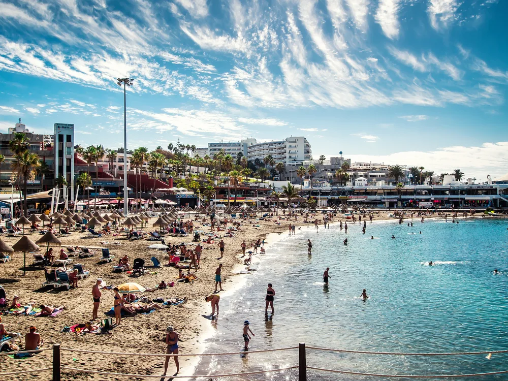 Extremely busy day in Tenerife with many people on Colon Beach pictured during the summer, the worst time to visit the Canary Islands due to the crowds