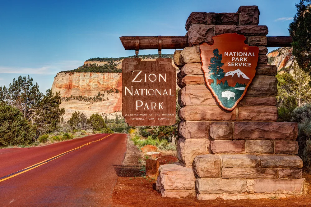 Sign at the east entrance to Zion pictured on a nice day