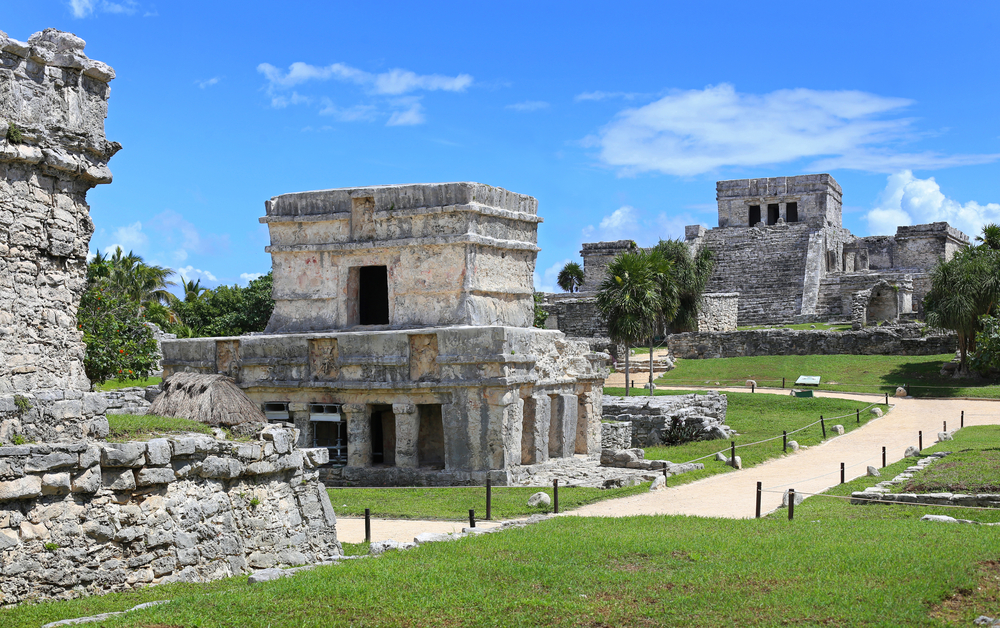 Mayan ruins in Tulum pictured during the best time to visit Tulum under blue skies with hardly anyone around