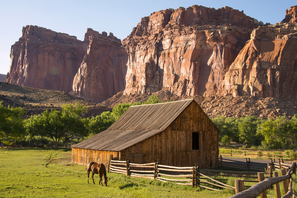 Historic red horse barn in Capitol Reef, seen during the best time to visit Utah