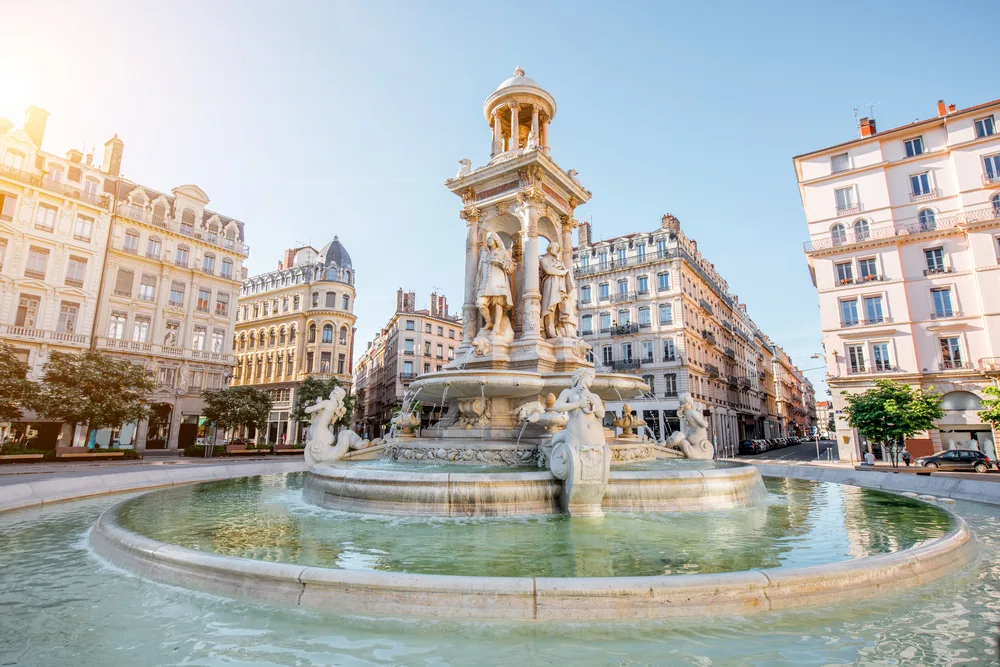 Morning view of Jacobins Square on a nice day with blue skies and a nice solar flare to the left pictured during the best time to visit Lyon