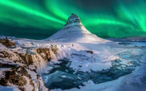 Photo of the Northern Lights over Mount Kirkjufell in Iceland, pictured during the overall best time to visit