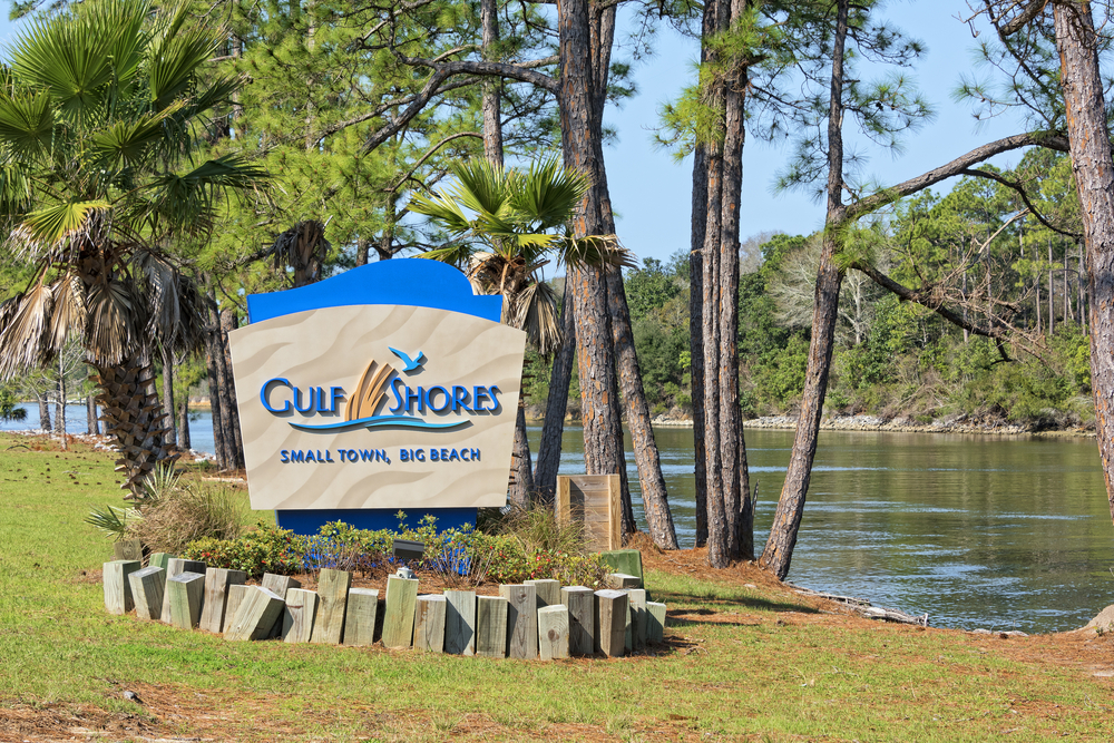 Welcome sign pictured next to a pond in Gulf Shores, seen during the best time to visit