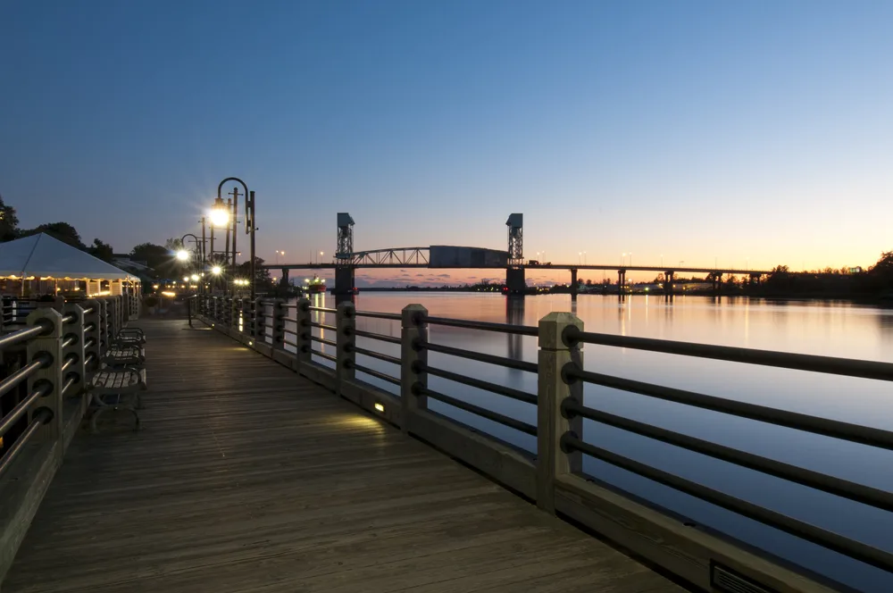 Night view of a sunset over Wilmington pictured during the overall least busy time to visit North Carolina