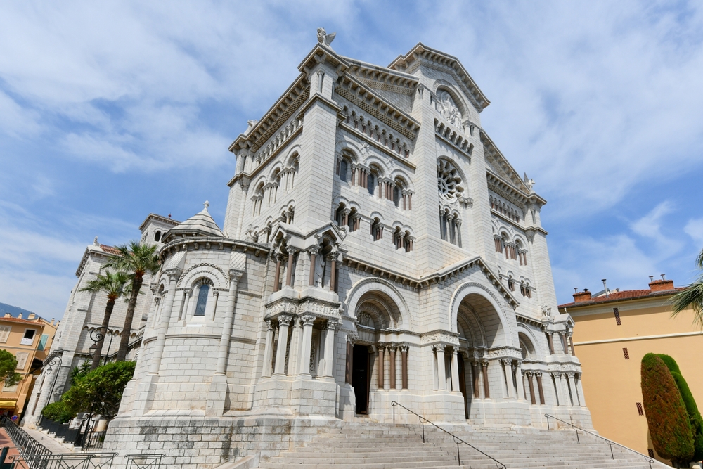 View looking up at the Cathedral of Our Immaculate Lady, formerly the Cathedral of Saint Nicholas, on a cloudy day in Monaco for a month-by-month comparison to show the best time to visit Monaco