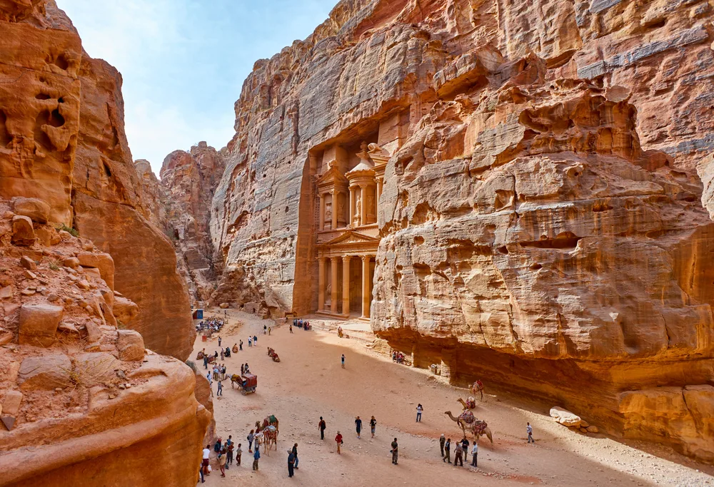 People milling around in front of Al Khazneh in the rock city of Petra during the worst months of the year to visit 